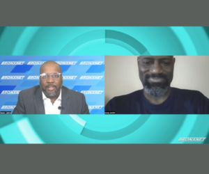 Two Black men in individual, horizontal Zoom panels, with a blue background exterior frame..