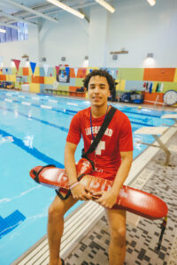 lifeguard sitting by pool